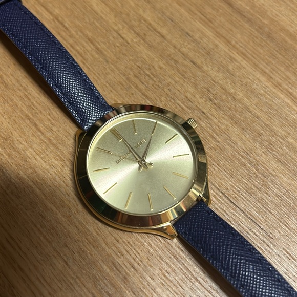 Beautiful authentic gold Michael Kors watch with a navy blue leather strap. - Picture 2 of 3